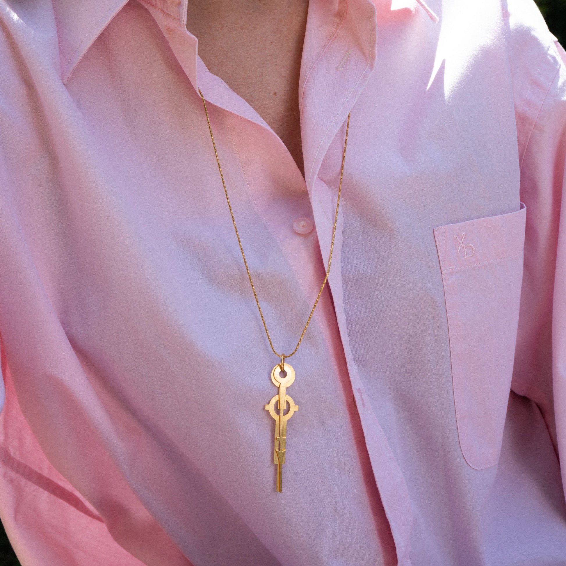 Sautoir Présent, inspiré de deux aiguilles d'horloge Art déco.